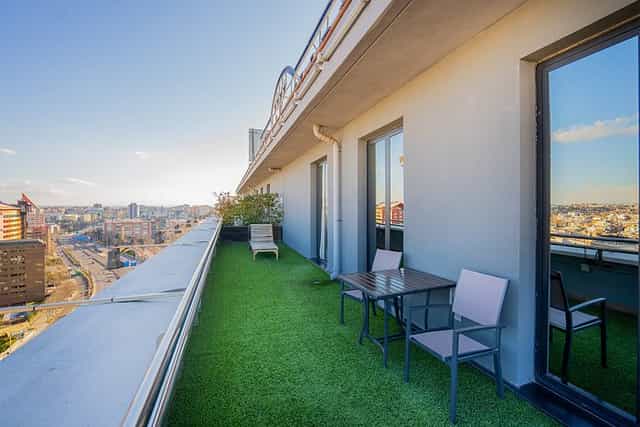 Rooftop event space at abba Madrid hotel with green turf and skyline views.