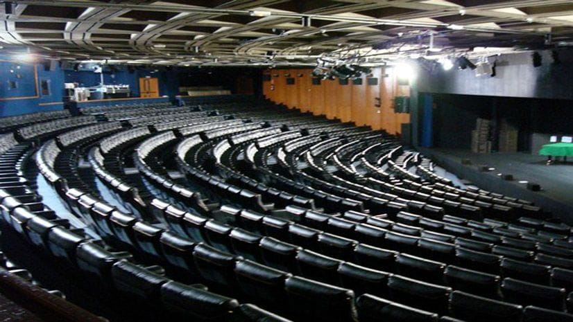 Spacious Sala Jardiel Poncela auditorium with tiered seating for events and performances.