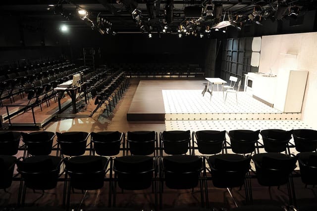 Versatile event space Sala Jardiel Poncela with well-lit stage for workshops and performances.