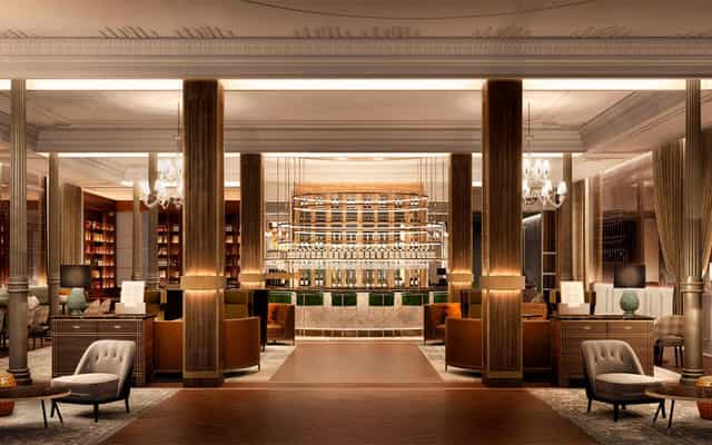 Elegant event space with plush seating at Gran Hotel Inglés for networking and receptions.