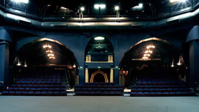 Teatro de la Abadía theater with plush seating, ideal for corporate events and performances.