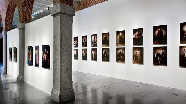 Art gallery with framed photographs on white walls, perfect for exhibitions and events.