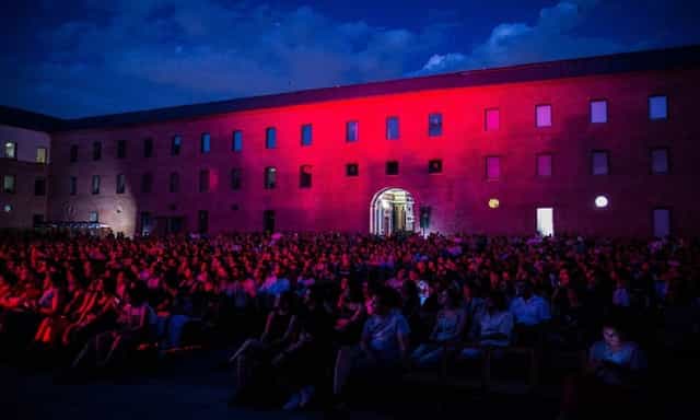 Auditorio at Condeduque with pink lighting, perfect for concerts and events.