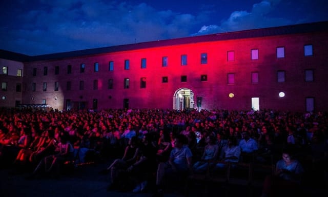 Auditorio at Condeduque with pink lighting, perfect for concerts and events.