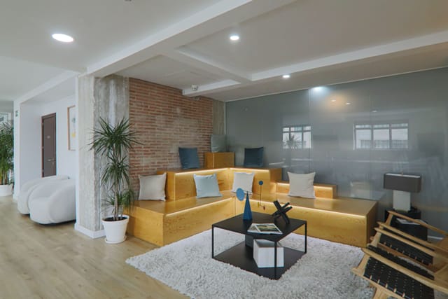 Stylish Manhattan meeting space with wooden seating for casual networking events.