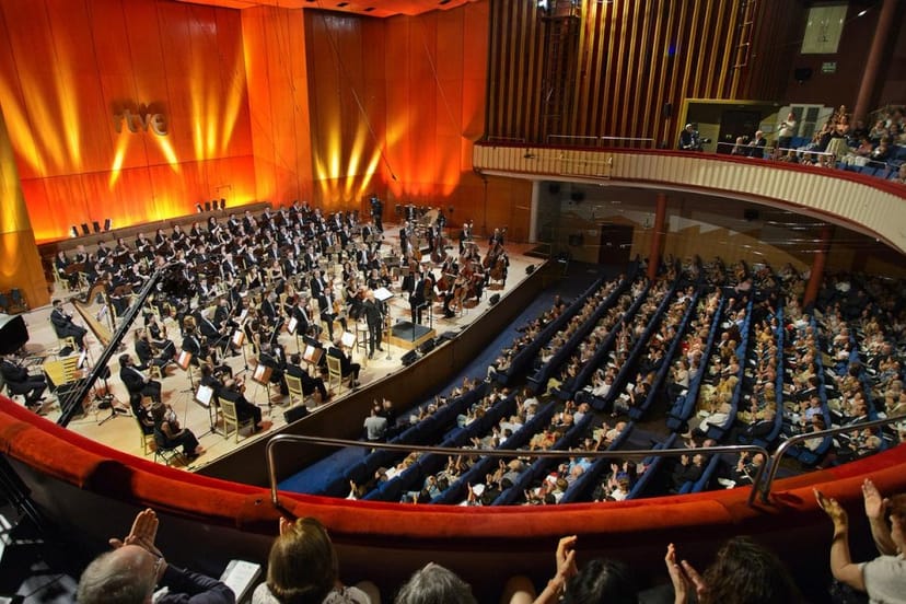 Elegant concert hall at Teatro Monumental with engaged audience for a high-profile event.