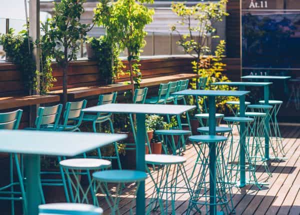 Stylish outdoor bar at Iberostar with turquoise furniture, ideal for casual networking events.