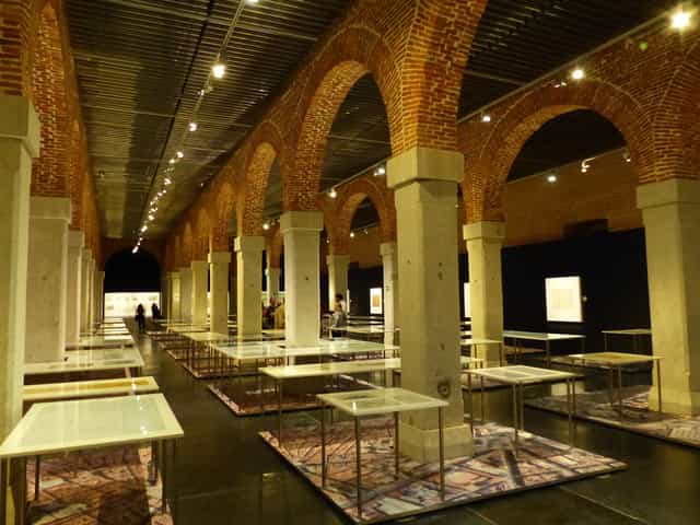 Art gallery with exposed brick arches, ideal for exhibitions and corporate events.
