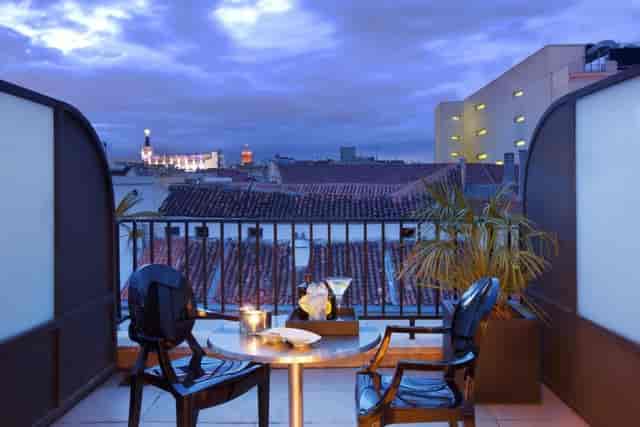 Stylish outdoor terrace at Hotel Villa Real, perfect for cocktail receptions and networking events.