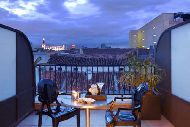 Stylish outdoor terrace at Hotel Villa Real, perfect for cocktail receptions and networking events.