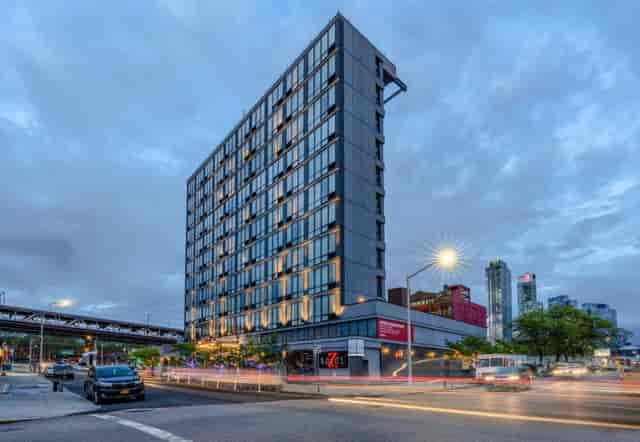 Modern hotel with inviting facade, perfect for corporate events in urban setting.