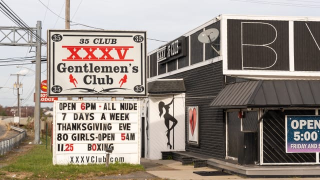 Main Stage at XXXV Gentlemen's Club, featuring distinctive signage for private events.