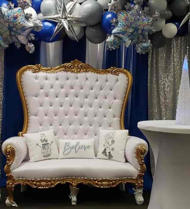 Elegant event venue with tufted white sofa, perfect for weddings and corporate functions.