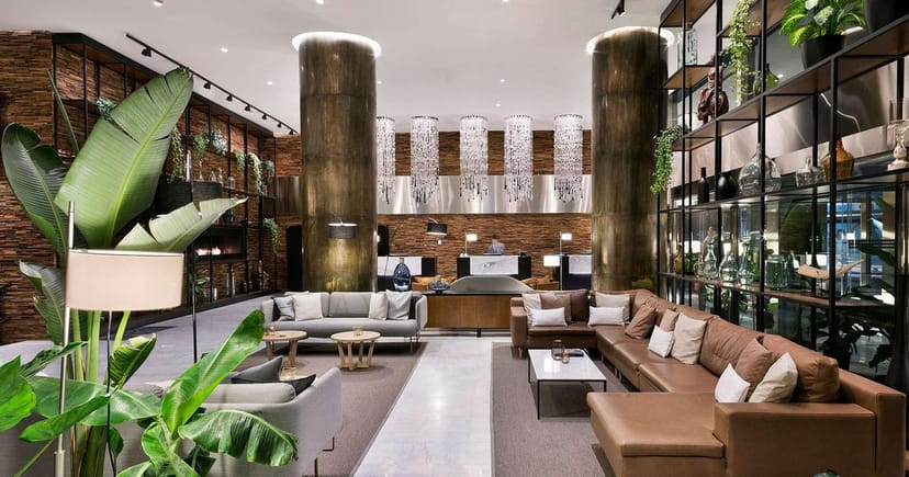 Modern lobby at Meliá Madrid Princesa, ideal for networking events and meetings.