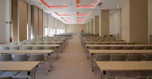Spacious conference room at Hotel Riu Plaza España for corporate events and training sessions.