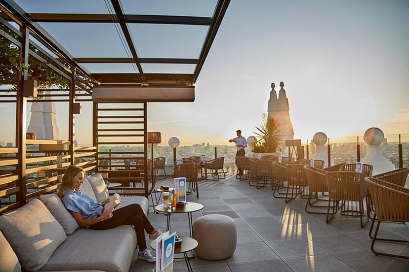 Rooftop bar at Hotel Riu Plaza España, ideal for upscale cocktail events with city views.