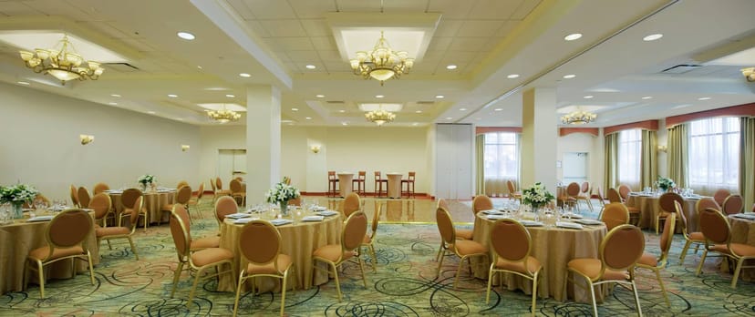 Elegant Hilton Meadowlands ballroom with chandelier lighting for banquets and meetings.
