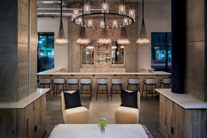 Industrial-chic bar at Watt Hotel Rahway, perfect for networking events and gatherings.