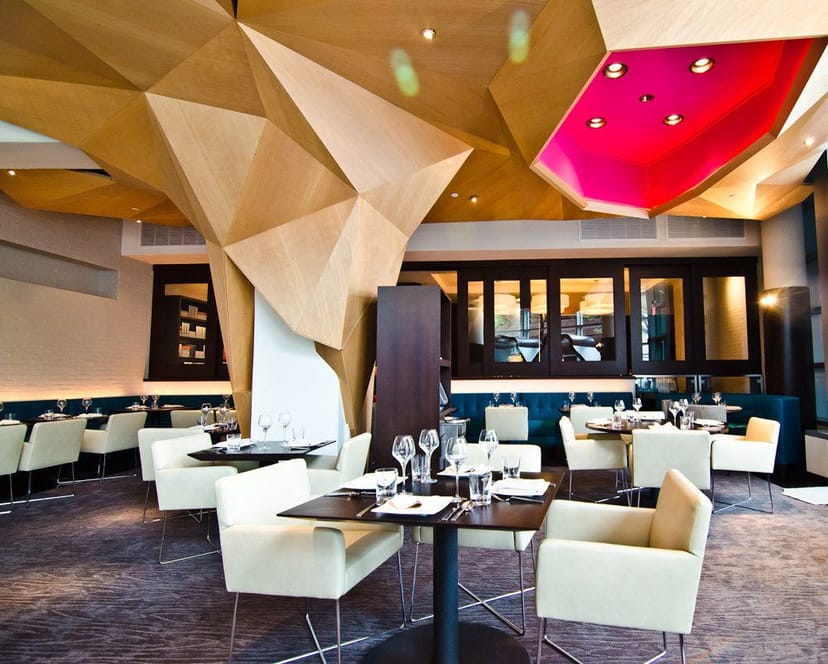 Private dining room with unique ceiling design for upscale events at Roof Terrace Restaurant.