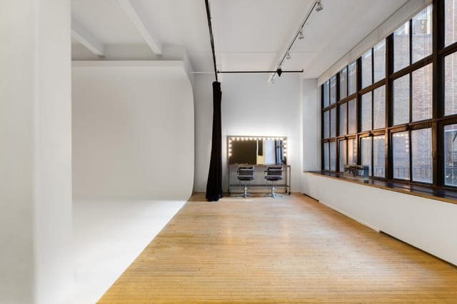 Versatile event space with natural light for corporate meetings and creative workshops.