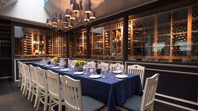Elegant dining space in L'Artusi for upscale corporate meetings and exclusive events.