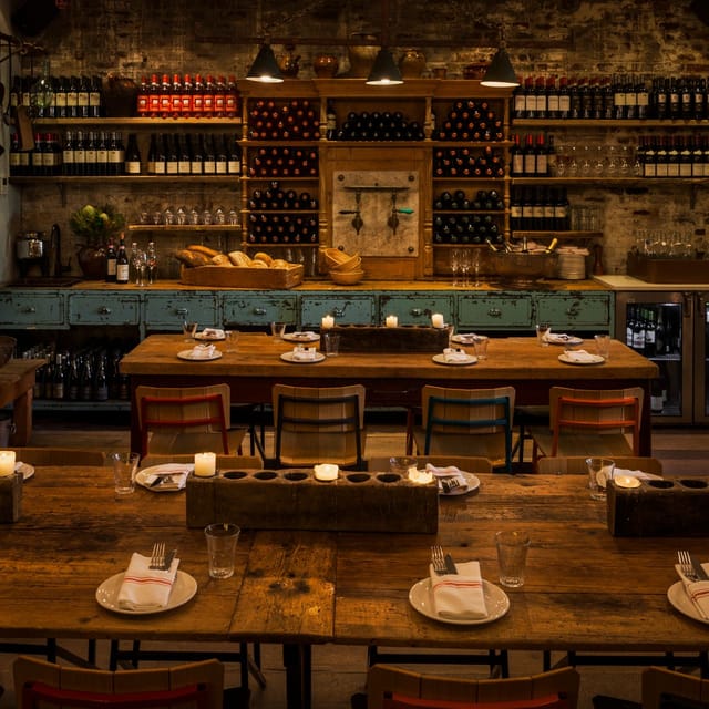 Cozy rustic dining setup at Salumeria for intimate events with warm wood tones.