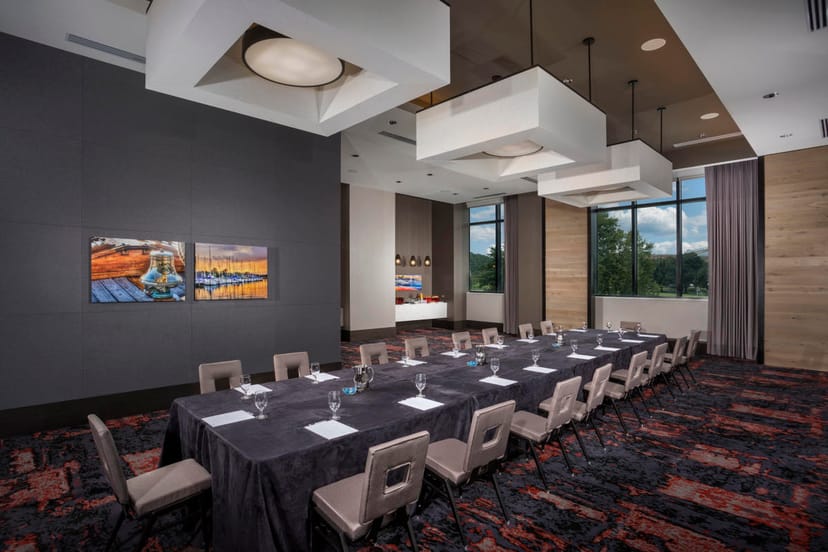 Diamondback Boardroom: Modern meeting space with natural light for corporate events and workshops.