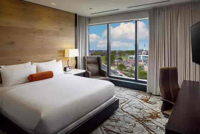 Rooftop Terrace hotel room with king bed, ideal for business travelers and networking events.
