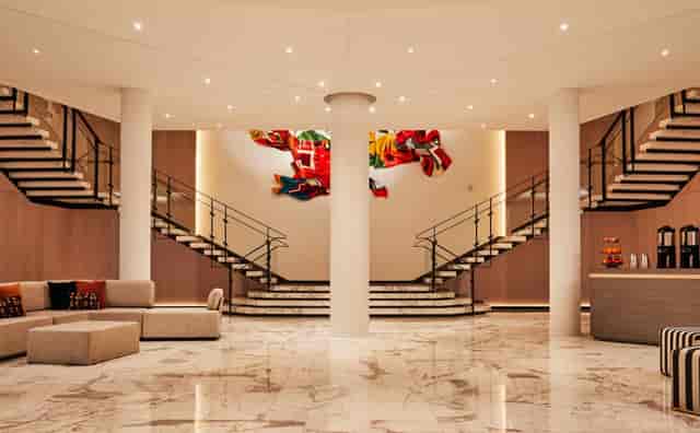 Elegant Vale Ballroom lobby with dual staircases for corporate events and meetings.