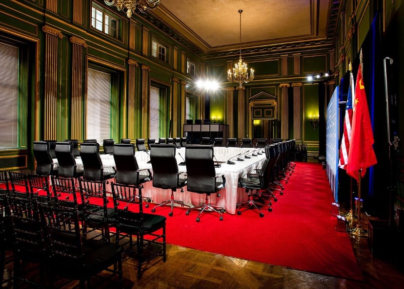 Private event space with elegant décor and high-back chairs for formal meetings.