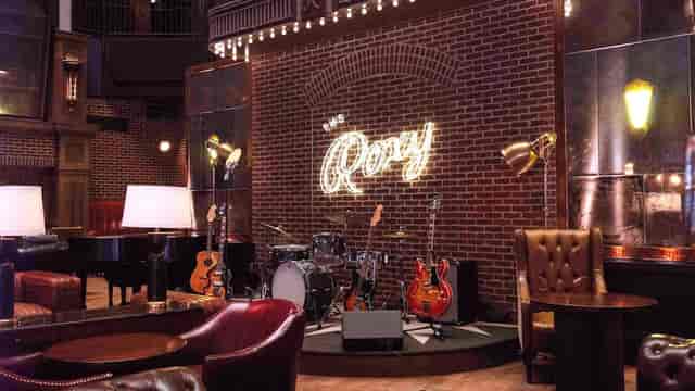 Oyster bar in The Roxy Hotel, inviting space for live music and gatherings.