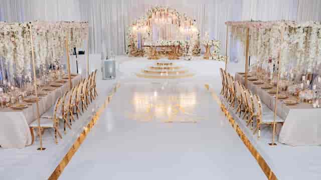 Elegant ballroom with floral decor, ideal for weddings and corporate events.