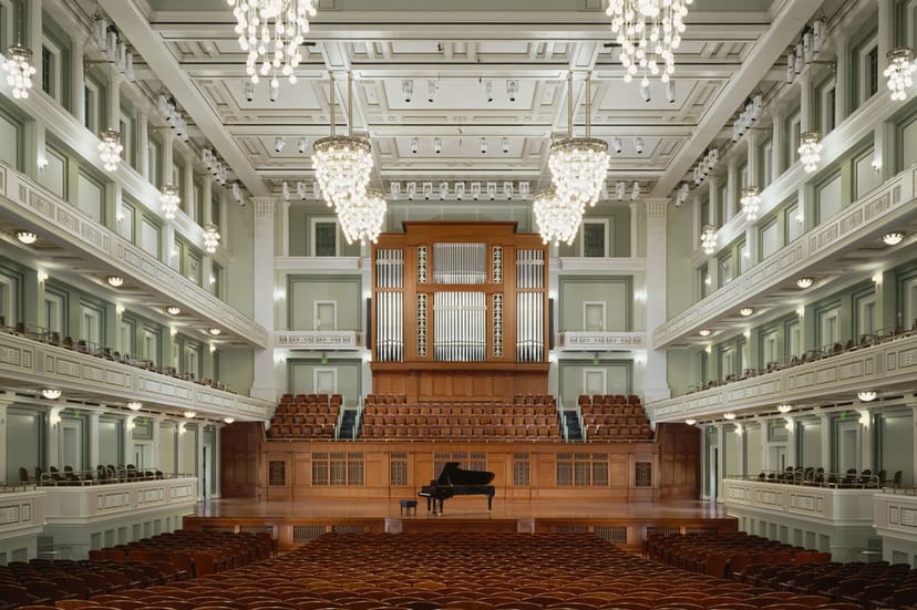 Elegant concert hall with chandeliers, ideal for concerts and gala events.