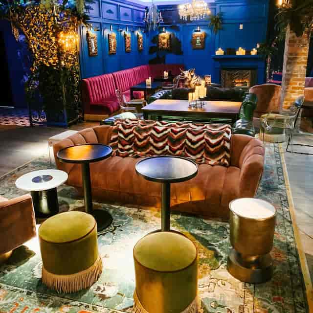 Stylish lounge at Harlot DC for networking and events with plush seating and intimate lighting.