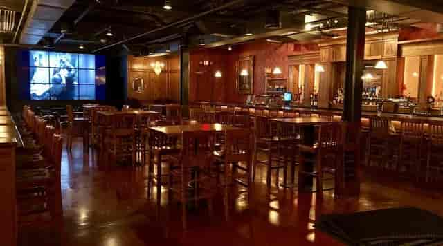 Upscale beer hall with wooden seating, ideal for networking and gatherings.