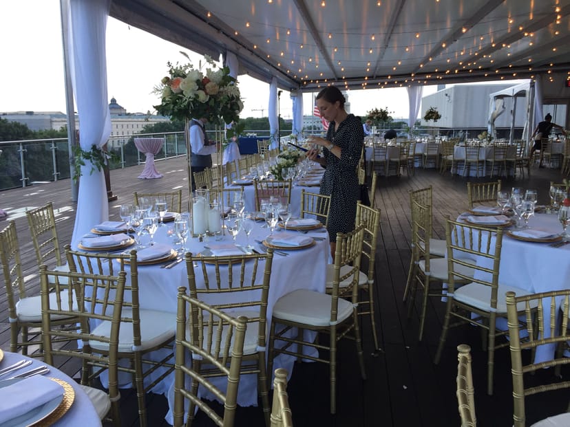 Elegant event space with gold chiavari chairs for sophisticated gatherings and outdoor events.