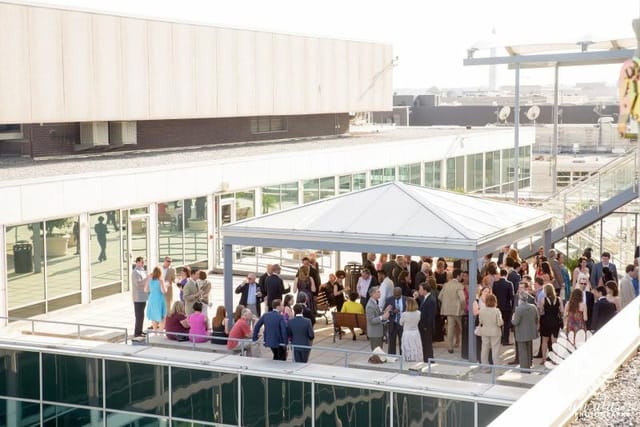 Rooftop networking event at Hall of the States with stylish tent and vibrant atmosphere.