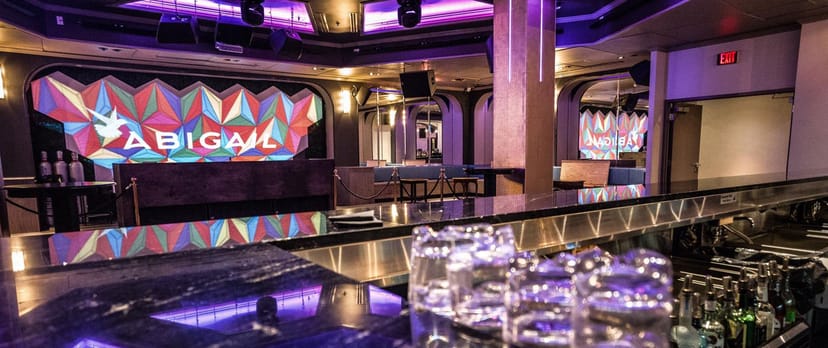 Vibrant nightclub bar in Abigail, perfect for cocktail and networking events.