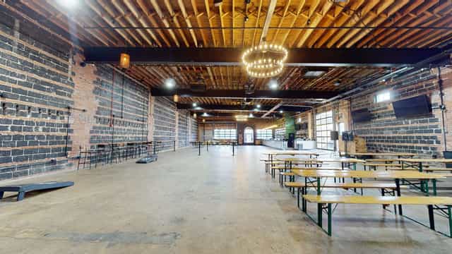 Rustic event space with exposed brick at Hook Hall, ideal for corporate and social gatherings.
