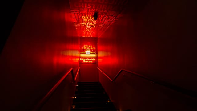 Illuminated red hallway in Jaleo, ideal for networking events and gatherings.
