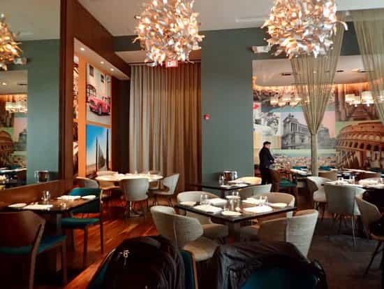 Semi-private dining area in Modena, stylish decor for intimate dinners and networking events.