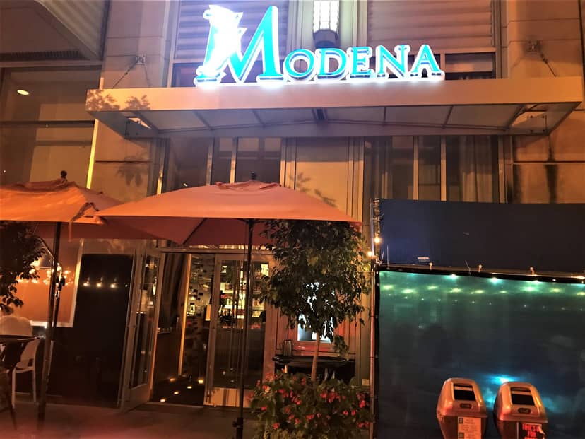 Semi-private dining area at Modena with outdoor seating, perfect for events and gatherings.