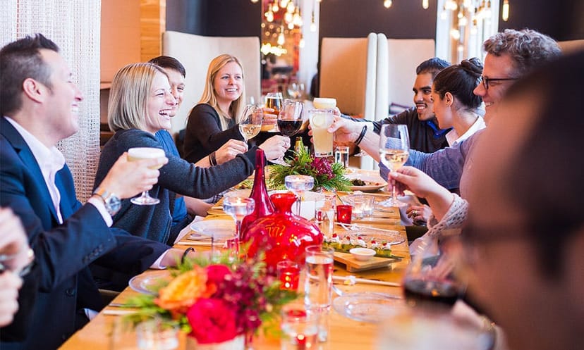 Vibrant dining room toast at China Chilcano, ideal for networking events and team-building.
