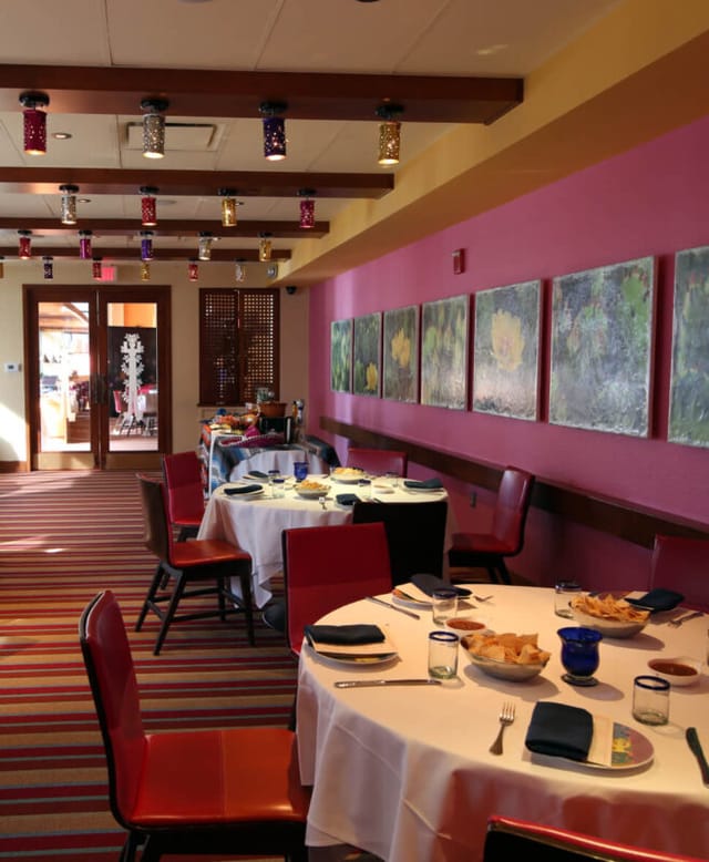 Private dining room at Rosa Mexicano with vibrant decor for intimate gatherings or meetings.