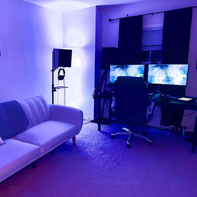 Modern recording studio with dual monitors, ideal for webinars and online conferences.