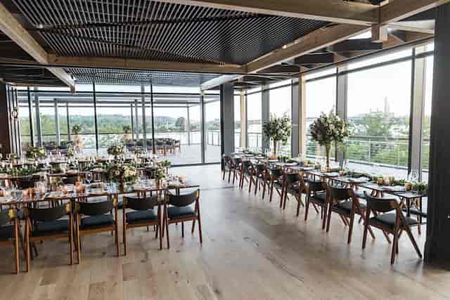 Sophisticated event space with floor-to-ceiling windows at District Winery.