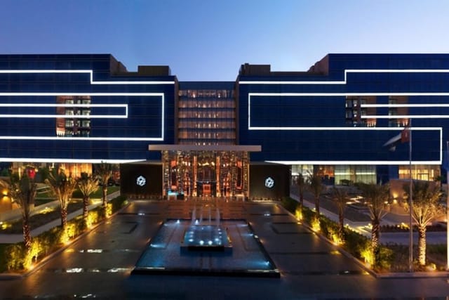 Modern hotel facade at Fairmont Bab Al Bahr, ideal for corporate events and meetings.