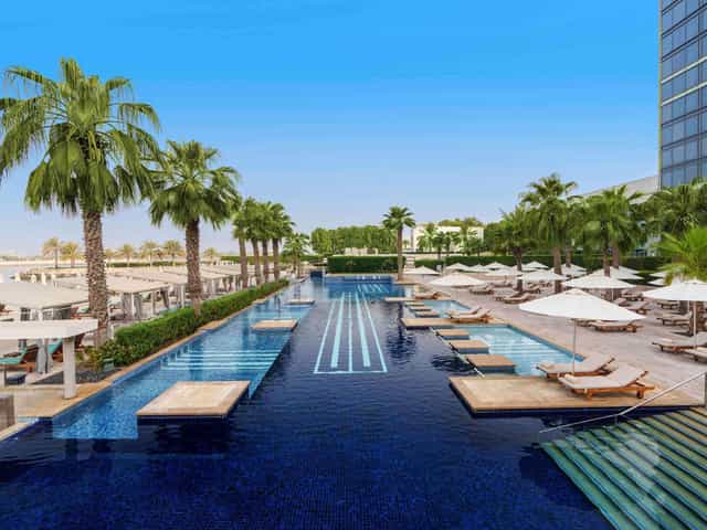 Luxurious outdoor pool at Fairmont Bab Al Bahr, ideal for upscale events and retreats.