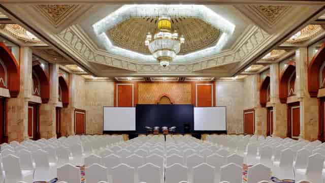 Auditorium at InterContinental Abu Dhabi with elegant chandelier, ideal for conferences.