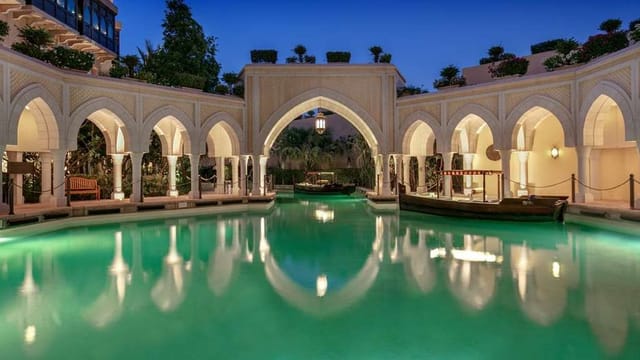 Narjess by serene turquoise pool in Shangri-La Hotel, perfect for upscale events.